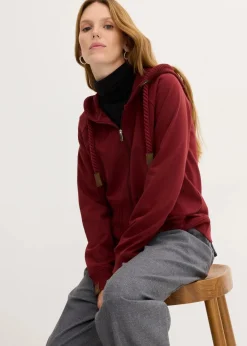 bonprix Sweat|Nachhaltigere Materialien^Sweatjacke mit Strickkapuze und Tasche rubinrot