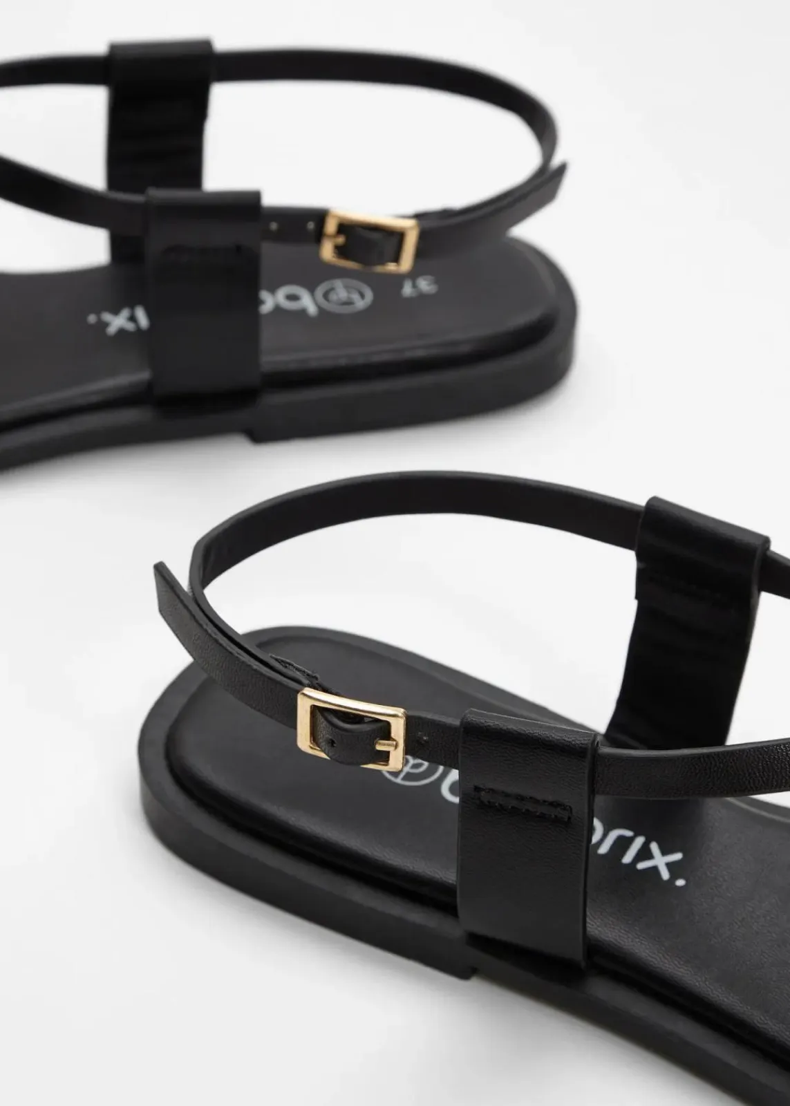 bonprix Sommerschuhe^Zehenstegsandalen mit Metallic-Detail schwarz